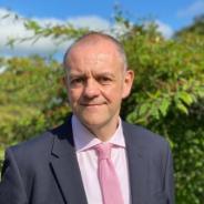 A picture of Dr Richard Harrison in the garden during summer